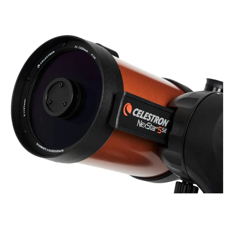 Close-up of NexStar 5SE Schmidt-Cassegrain Telescope Bundle With Eyepiece Kit, orange tube and black mount visible.