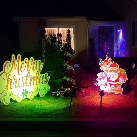 Solar Outdoor Lights With 9 Modes Color Changing 18 LED Spotlight illuminating Christmas decorations in garden