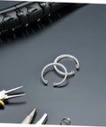 5 Piece Stainless Steel C Clip Retaining Ring Kit With Internal And External Circlips Snap Rings For Secure Attachment And Easy Installation No Fuss For DIY Projects Machinery And Auto Repairs, showing tools and tire in background