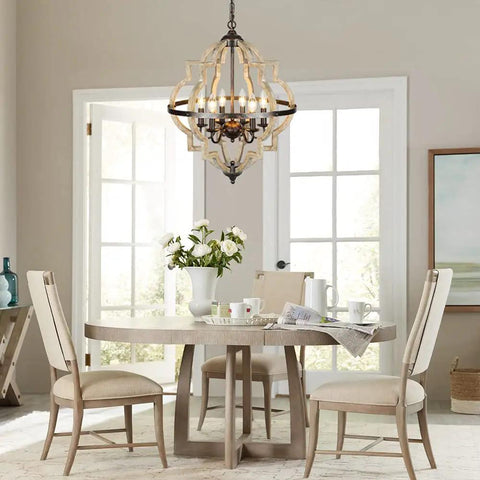 Geometric Orb 6-Light Farmhouse Chandelier with Stardust Finish hanging over dining table, rustic oak frame visible.
