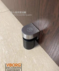 Side view of Beefy Heavy Duty Stainless Steel Floor Mount Magnetic Pop Up Door Stop With Solid SUS304 Casting, installed on a wooden door.