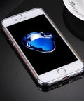 Smartphone with screen displaying a blue abstract design on a shiny black surface
