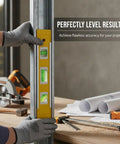 Person using Spirit Level, Anodized Aluminum on metal frame for accurate leveling in construction work.