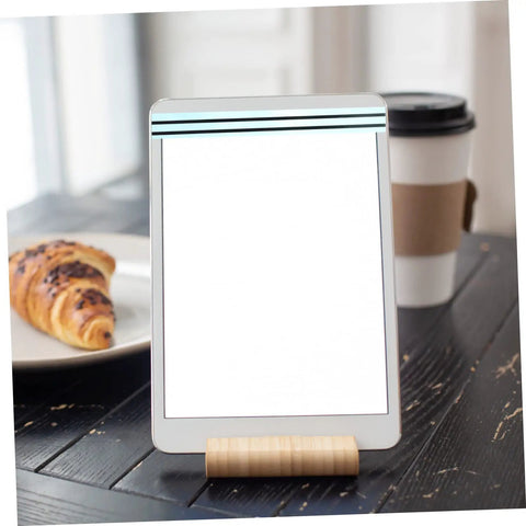 Tablet stand on table with croissant and coffee cup in background