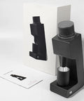 Single Dose Coffee Grinder Featuring Killer Cone Burr Precision And Variable Speed Controls, black CNC aluminum design.