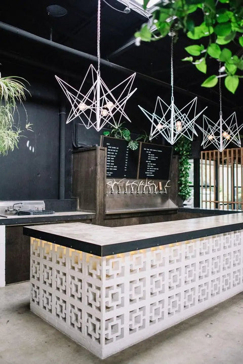 Bar counter with Breeze Brick Molds For Concrete, Double Square Design; decorative wall tiles, outdoor setting, ambient lights