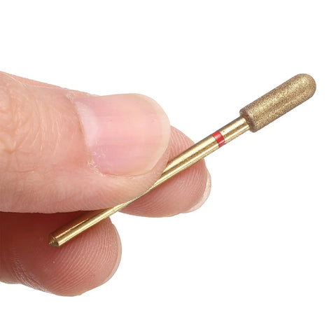 Close-up of a finger holding a Ten Piece 200 To 230 Grit Diamond Grinding Bits Set With Four Millimeter Cylindrical Ball Head And Two Point Three Five Millimeter Shank For Rotary Tools Nails Grinding And Polishing Titanium Plated Stone Sanding Bits.