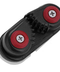 Front view of cam cleat rope clutch: black aluminum body with red recessed screws and central teeth