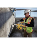 Heavy Duty Cordless 20V Brushless Rotary Hammer Drill Sick Power Bad Boy in use for concrete drilling by a worker.