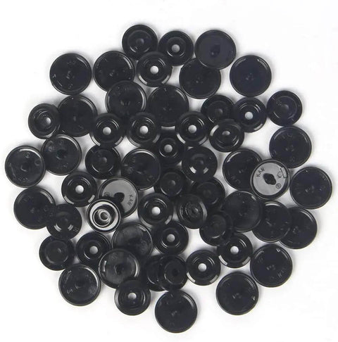 Black plastic pieces from Snap Fasteners Kit With Pliers, 420 Complete Sets In 14 Colors, No Sew Plastic Snaps for Crafts and Clothing.