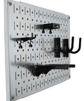Side view of a galvanized steel modular pegboard wall organizer with attached hooks, part of the Modular Pegboard Wall Organizer Tiles Set DIY Friendly Four 12 Inch Tall By 16 Inch Wide Steel Peg Board Panels Galvanized Metal Storage Tiles Easy To Install Expandable Wall System That Accepts Round Pegs And Slotted Pegs.