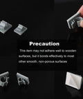 Close-up of Fifteen Pack Adhesive RO Tubing Holder Clips for One Quarter Inch Water Filter Tubing with user holding one clip.