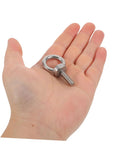 Hand holding Stainless Steel Eyebolts With Closed Ring M6x20 For Heavy Duty Hanging, Beefy Load Bearing Eye Bolts With Washer And Nut, Concrete Or Wood Anchor Screws, Durable, Secure Mounts For Outdoor Gear Or Equipment