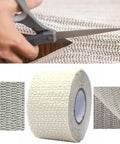 Double-Sided Anti-Slip Rug Tape Gripper For Hardwood Floors And Tile being cut with scissors, roll and material texture shown