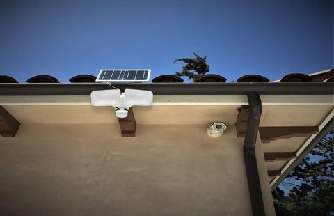 Installed Solar Powered AI Smart Motion Dual Head LED Flood Light 10W 1200 Lumens Outdoor Security Glow on house exterior