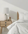 Modern bedroom featuring a nightstand with Straight Up Sleek Flush Ring Pull, Two Pack Low Profile Drawer Handles, Solid Zinc Alloy Cabinet Hardware, Brushed Silver.