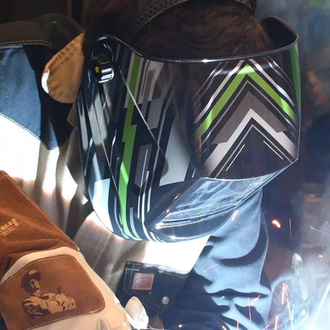 Pro Series Amped ADF Welding Helmet in use, lightweight fireproof shell, multi-directional 5 point headgear, welding sparks visible