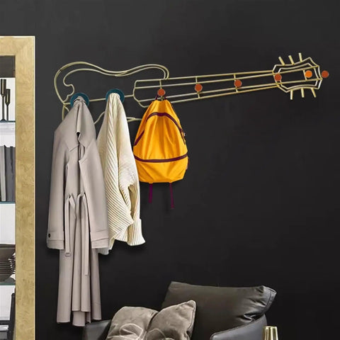 Modern Wall Mount Coat Hooks Dang Handy Entryway Storage Rack Easily Hangs Coats Jackets And Keys With Heavy Duty Steel Frame Built For Everyday Grind At Home, styled like a guitar with coats and a backpack.