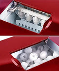 Hella Quick Countertop Ice Maker Machine With Dope Stainless Steel Build And 220V Power, showing ice cubes and snow flakes inside ice chamber.