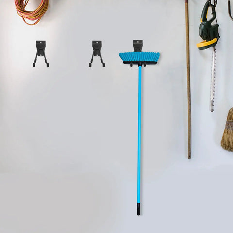 Rock Solid Black Metal Wall Hooks For Bags And Hats With Heavy Duty Mount That Keeps Your Space Looking Crisp And Organized Without Any Hassle For Hanging Coats And Towels In The Garage Or Bathroom Too. mounted with cleaning tools and cords on a garage wall.
