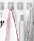 Heavy Duty Adhesive Wall Hooks Up To 50 Lbs No Drill No Damage Clear Waterproof Wall Hangers holding keys, bag, towel