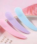 Bulk 200 Mini Makeup Spatulas With Storage Box Disposable Cosmetic Spatulas In Pink Blue Purple Perfect For Pros And Salons Skincare Samples Beauty Demos And Home DIY Cosmetic Kits. Pink, purple, and blue mini plastic spatulas on a tray.