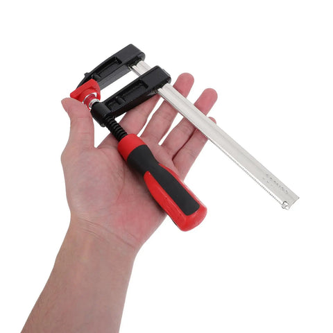 Heavy Duty 6 Inch F Clamp With Quick Adjustment And Antirust Finish For Welding Projects and Workshop Environments Featuring One Hand Operation and Durable Metal Bar Design Perfect For Woodworking and DIY Builds in a hand.