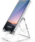 Clear Acrylic Cell Phone Stand For Your Desk And Office holding a phone with a charging cable connected