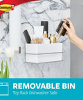 Wall And Cabinet Organizer With Water Resistant Strips For Clutter Free Bathroom No Tools Needed Easy Open Packaging Includes One Organizer And Four Large Strips featuring toiletries and hairbrush on bathroom wall.