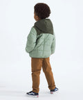 Rear view of a child wearing Kids Reversible Shasta Full Zip Hooded Jacket - Water-Resistant Puffer With Synthetic Insulation.