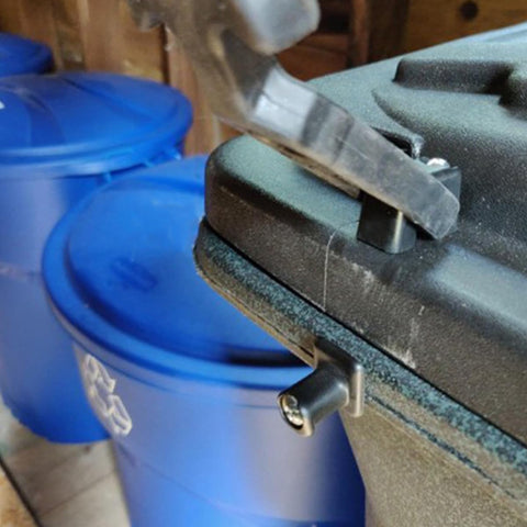 Two Pack Flexible Rubber T Handle Draw Latches With Shock Absorption on black surface, shown against blue lids