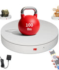 Foxvee Motorized Electric Turntable Remote Controlled Rotating Display Stand Speed Adjustable 360 Degree Photography Platform showcasing a 100 lbs red kettlebell
