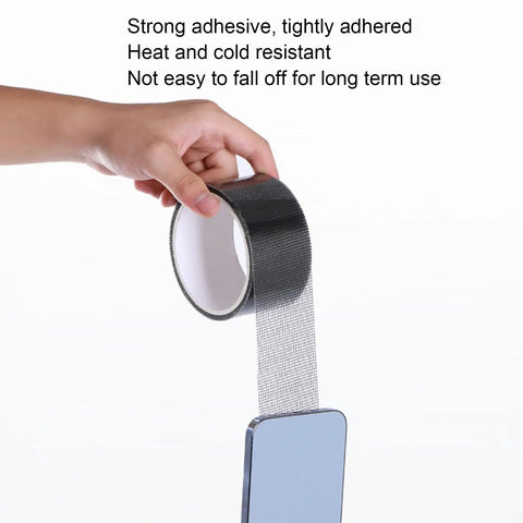 Hand holding Strong Adhesive Screen Repair Tape For Windows And Doors No Tool Needed Quick Fix For Tears And Cracks Self