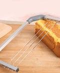 Adjustable Cake Leveler And Wire Slicer For Even Layer Cakes Pro Grade Stainless Steel Cutter slicing cake on wooden board