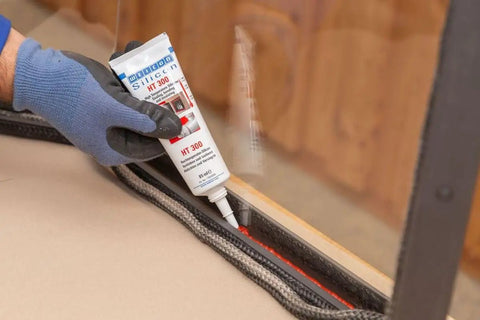 Applying Heavy Duty High Temp Silicone Sealant For Sealing Bonding And Insulating Withstand Up To 572 Fahrenheit Red For Oven Chimney Adhesive In Home And Industrial Use Two Point Eight Ounce to a glass edge.