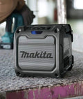 Cordless Job Site Bluetooth Speaker For Power Tools 18V LXT And 12V Max CXT showing rugged design on construction site
