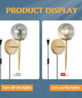 2 Light Plug In Globe Wall Sconce With Smoky Gray Glass Shade And Brass Finish Delivers A Cozy Vibe And Soft Glow For Bathroom Bedroom Hallway Corridor Modern Bedside Lighting shown with lights off and on