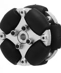 Close-up of 38mm aluminum omni wheel with metal hubs and black rubber rollers