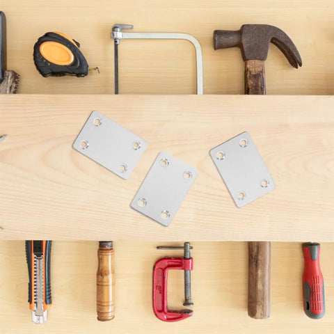 Flat Corner Brackets Set Stainless Steel 30 Pcs For Furniture Repair And Shelving Reinforcement Metal Corner Brace Plates resting on wooden surface