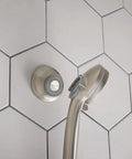 Spot Resistant Remote Dock For Magnetix Handheld Shower Head In Brushed Nickel Finish with hexagonal tile background.