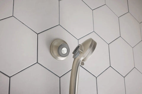 Spot Resistant Remote Dock For Magnetix Handheld Shower Head In Brushed Nickel Finish with hexagonal tile background.