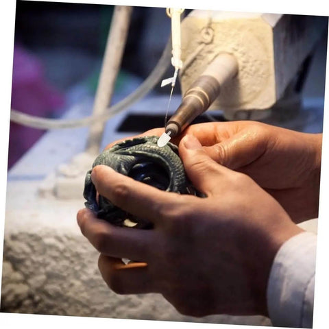 Close-up of hands using a rotary tool with a 120 Piece Wool Felt Polishing Wheel Set With Arbor Shaft And Rotary Buffing Pads