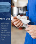 Blue 14x14 Inch 100-Pack Cotton Auto Shop Towels For Detailing And Industrial Cleaning being used to clean tool in workshop