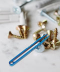 Titanium Alloy Tweezers Compact Machining Clamp Mini Travel Tool with screws on marble surface