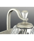 Close-up of Anjoux Dope Two Light Gray Bath Vanity Light with clear water glass shade and polished nickel accent, modern style detail