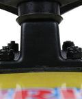 Close-up of Skateboard Hardware Kit 1 1/8 Inch Phillips Nuts And Bolts 8 Piece Set Black for Trucks and Decks on yellow board.