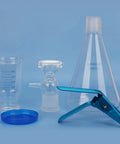 Vacuum Filtration Set With Borosilicate Glass Filter Flask 1000 Milliliters, 10 Micron Sand Core Filter Plate, And 300 Milliliters Graduated Beaker For General Filtration And Precise Vacuum Filtration In The Lab displayed with glass components and clamp.