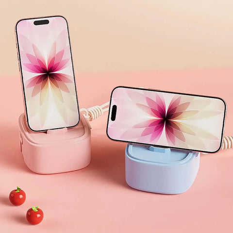 Badass Hella Tough Shockproof EDC Case For Bluetooth Headphones in pink and blue with phones on stands and small decorative items.