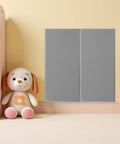 Rock Solid Premium Peel And Stick Xpe Foam Wall Pads mounted on nursery wall next to plush dog toy.
