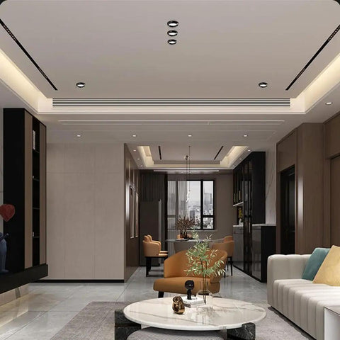 Living room featuring XYIANG 4.3 Inch Led Recessed Lighting with Black/Gold Wall Washer Trim, highlighting modern design.